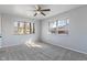 A light blue bedroom has natural lighting and a ceiling fan at 5124 Wexford Rd, Indianapolis, IN 46226