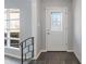 Inviting entryway with slate floors, decorative glass front door, and an abundance of natural light at 5124 Wexford Rd, Indianapolis, IN 46226