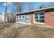 View of a patio area on the rear of a single Gathering home with brick and siding at 5124 Wexford Rd, Indianapolis, IN 46226
