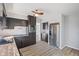Spacious kitchen with stainless steel refrigerator, black cabinets and wood countertops at 5124 Wexford Rd, Indianapolis, IN 46226