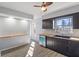 Stylish kitchen featuring black cabinets, butcher block counters, and stainless steel appliances at 5124 Wexford Rd, Indianapolis, IN 46226