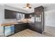 Modern kitchen boasts black cabinets, butcher block countertops, and stainless steel appliances at 5124 Wexford Rd, Indianapolis, IN 46226