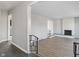 Open-concept living room with fireplace, light gray walls, and modern flooring, offering a bright and airy feel at 5124 Wexford Rd, Indianapolis, IN 46226