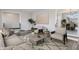Stylishly furnished living room with a neutral color palette, modern decor, and an open view to the dining area at 5124 Wexford Rd, Indianapolis, IN 46226