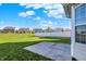 Concrete patio with views of well-maintained backyard and surrounding homes, great for entertaining and relaxation at 5648 Juniper Ct, Whitestown, IN 46075