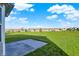 Concrete patio with views of large backyard and surrounding homes, perfect for entertaining and outdoor enjoyment at 5648 Juniper Ct, Whitestown, IN 46075