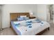 Comfortable bedroom with a wooden bed frame, stylish bedding, and a bedside table with a lamp at 5648 Juniper Ct, Whitestown, IN 46075