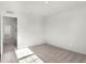 An empty bedroom with carpet and a window providing natural light, ready for personal touches at 5648 Juniper Ct, Whitestown, IN 46075