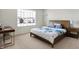 Cozy bedroom with plush carpet, a large window, and modern furniture at 5648 Juniper Ct, Whitestown, IN 46075