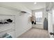 Spacious walk-in closet with wire shelving for ample storage and a window for natural light at 5648 Juniper Ct, Whitestown, IN 46075