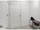 Neat entryway featuring a white door and a shoe rack stocked with various pairs of shoes at 5648 Juniper Ct, Whitestown, IN 46075