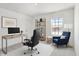 Inviting home office featuring a modern desk, comfortable chair, bookshelf, and ample natural light at 5648 Juniper Ct, Whitestown, IN 46075