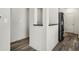 A modern kitchen with stainless steel appliances and luxury vinyl plank flooring at 5648 Juniper Ct, Whitestown, IN 46075