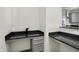 A kitchen area features granite countertops and gray cabinetry, offering both style and functionality at 5648 Juniper Ct, Whitestown, IN 46075