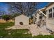 Backyard with a storage shed and a well-maintained gravel area at 5757 E 21St St, Indianapolis, IN 46218