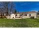 Expansive backyard featuring a detached storage shed and mature trees at 5757 E 21St St, Indianapolis, IN 46218