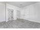 Bright bedroom features stylish mirrored closets, and a door to the hallway at 5757 E 21St St, Indianapolis, IN 46218