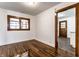Bright bedroom featuring hardwood floors, fresh white paint, and natural light at 5757 E 21St St, Indianapolis, IN 46218