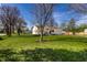 Scenic view of the home and lawn nestled in a peaceful neighborhood at 5757 E 21St St, Indianapolis, IN 46218