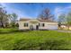 Charming one-story home with an attached garage and a well-manicured front yard at 5757 E 21St St, Indianapolis, IN 46218