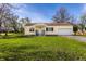 Lovely one-story home boasting an attached garage and a vibrant green lawn at 5757 E 21St St, Indianapolis, IN 46218