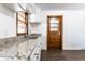 Well-appointed kitchen with granite countertops, bright window and a modern sink at 5757 E 21St St, Indianapolis, IN 46218