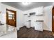 Charming kitchen boasts granite countertops, stainless hood, and white shaker cabinets at 5757 E 21St St, Indianapolis, IN 46218