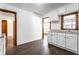Lovely kitchen showcasing white cabinets, hardwood trim, and granite countertops at 5757 E 21St St, Indianapolis, IN 46218