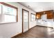 Sunny bonus room with built-in cabinets, modern floors, and two windows at 5757 E 21St St, Indianapolis, IN 46218