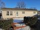 Backyard view with a small wood deck and greenery at 5816 Coppock Ln, Indianapolis, IN 46221