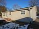 Backyard of ranch-style home featuring the siding and trimmed trees at 5816 Coppock Ln, Indianapolis, IN 46221
