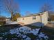 Fenced backyard space of home with a wood deck at 5816 Coppock Ln, Indianapolis, IN 46221