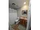 Bathroom with a shower/tub combo and a vanity with a sink at 5816 Coppock Ln, Indianapolis, IN 46221
