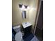 Bathroom featuring vanity, sink, and toilet with tiled floors at 5816 Coppock Ln, Indianapolis, IN 46221
