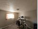 Spacious carpeted bedroom with a window and an area for a desk setup at 5816 Coppock Ln, Indianapolis, IN 46221