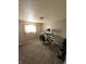 Carpeted bedroom featuring neutral walls and a window with patterned curtains at 5816 Coppock Ln, Indianapolis, IN 46221