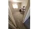 Bedroom featuring neutral carpet and a window with partially open door at 5816 Coppock Ln, Indianapolis, IN 46221