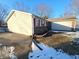 Ranch-style home showcasing the exterior and attached garage at 5816 Coppock Ln, Indianapolis, IN 46221