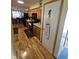 Well-appointed kitchen with hardwood floors, wooden cabinets, and modern black appliances at 5816 Coppock Ln, Indianapolis, IN 46221