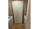 Compact laundry room with modern washer and dryer, and neutral wall paint at 5816 Coppock Ln, Indianapolis, IN 46221