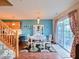 Bright dining room featuring a sliding glass door, stylish decor, and hardwood floors at 5944 Streamwood Ln, Indianapolis, IN 46237