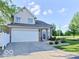 Charming two-story home with a two car garage, brick facade and a well-maintained lawn at 5944 Streamwood Ln, Indianapolis, IN 46237