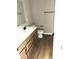 Bathroom with vanity, toilet, mirror, and wood flooring at 618 Firefly Ct, Greenfield, IN 46140