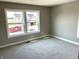 Bedroom with neutral walls, carpet, and a view of a construction site from the window at 618 Firefly Ct, Greenfield, IN 46140
