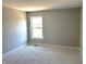 Bedroom with neutral walls, carpet, and a single window overlooking the outside at 618 Firefly Ct, Greenfield, IN 46140