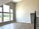 Bright living room with large windows, wood floors, and a staircase at 618 Firefly Ct, Greenfield, IN 46140