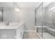 Bathroom showcasing dual vanity sinks, tiled floor, and glass shower at 6723 Collisi Pl, Brownsburg, IN 46112