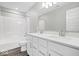 Modern bathroom featuring a dual sink vanity, granite countertops, and a shower-tub combo at 6723 Collisi Pl, Brownsburg, IN 46112