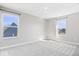 An airy bedroom with neutral walls, plush carpet, and views from each of three windows at 6723 Collisi Pl, Brownsburg, IN 46112