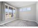 Bedroom with large windows and neutral carpet at 6723 Collisi Pl, Brownsburg, IN 46112